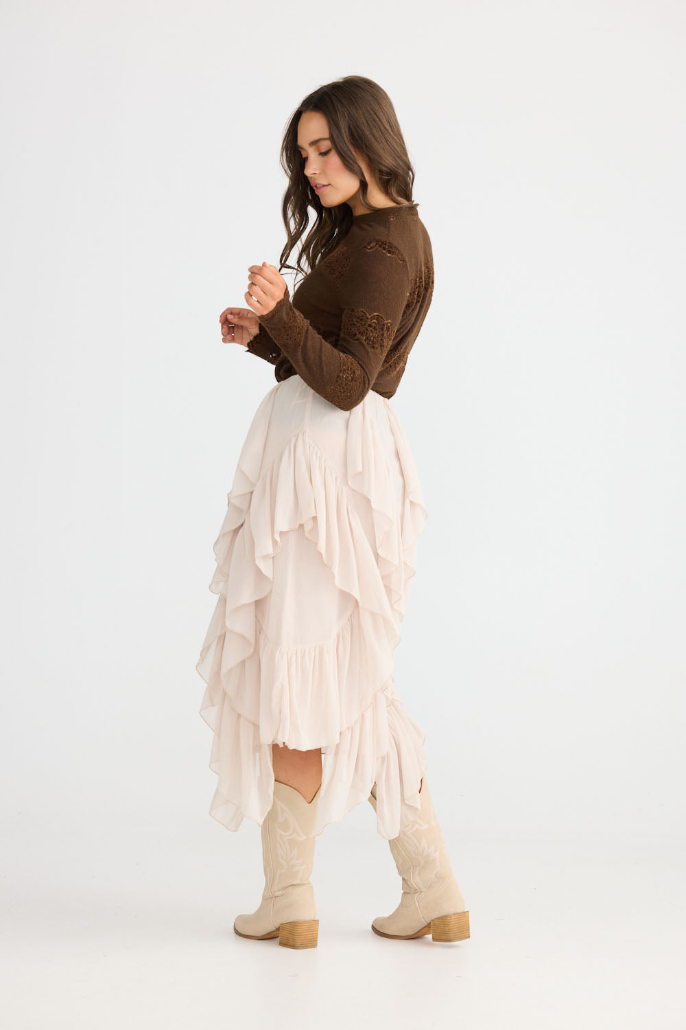 Model wearing Rafael Skirt in almond with elasticated waist, back view on white background