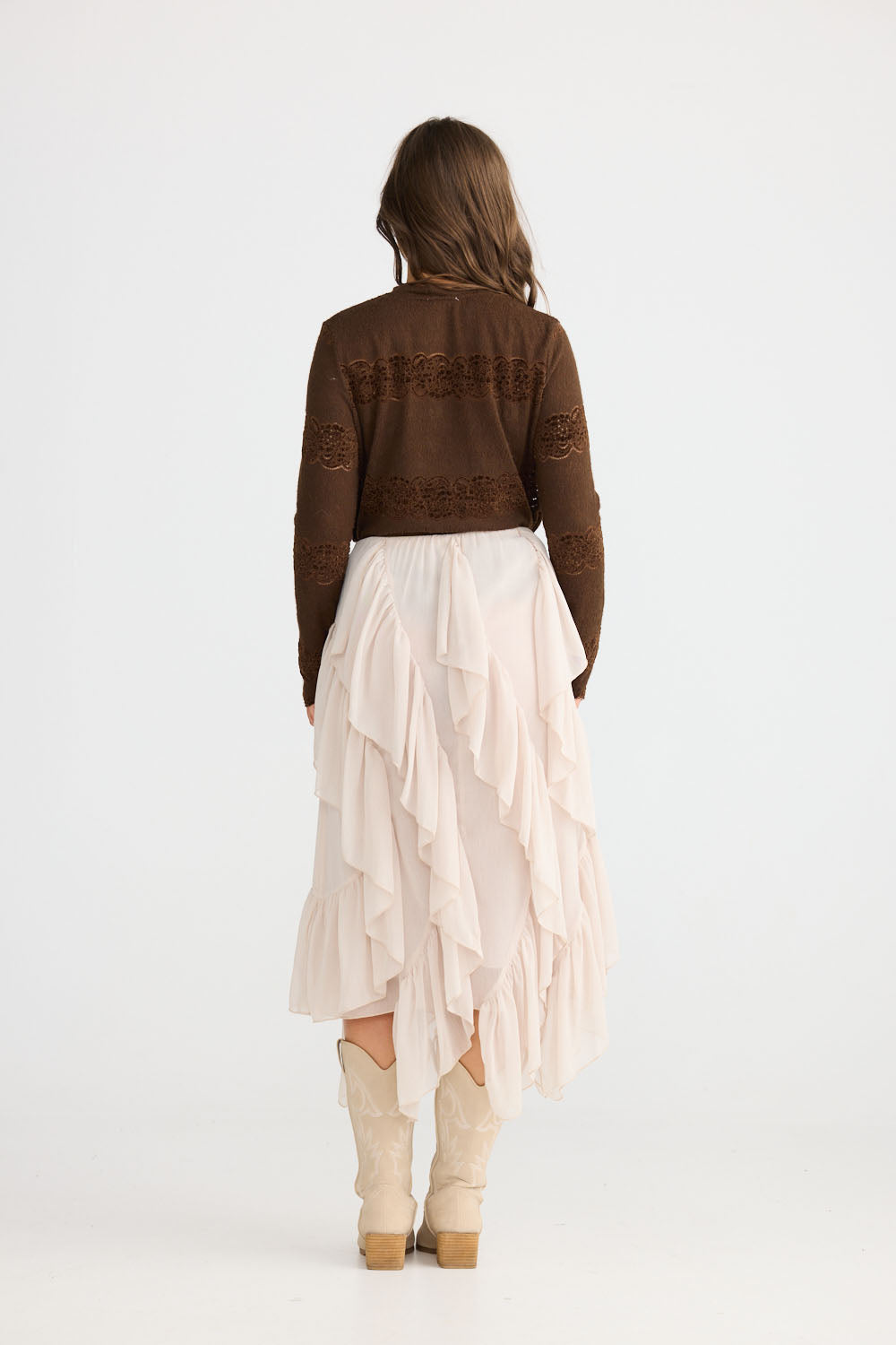 Model wearing Rafael Skirt in almond with elasticated waist, side view on white background