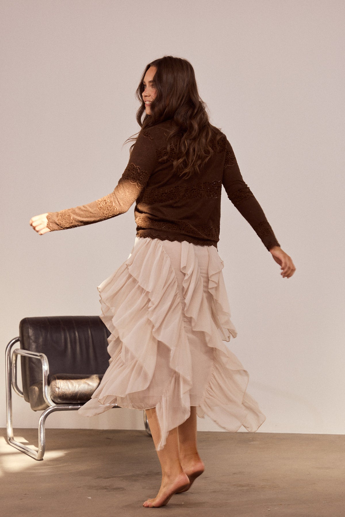 Model wearing Rafael Skirt in almond with elasticated waist, front view on white background