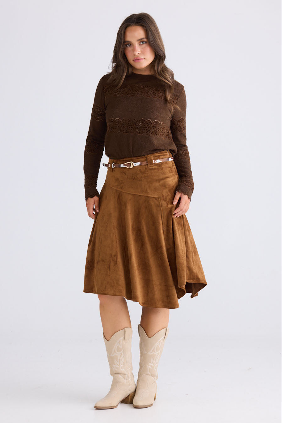 Model wearing Runa Skirt in chocolate with natural waist fit, front view on white background
