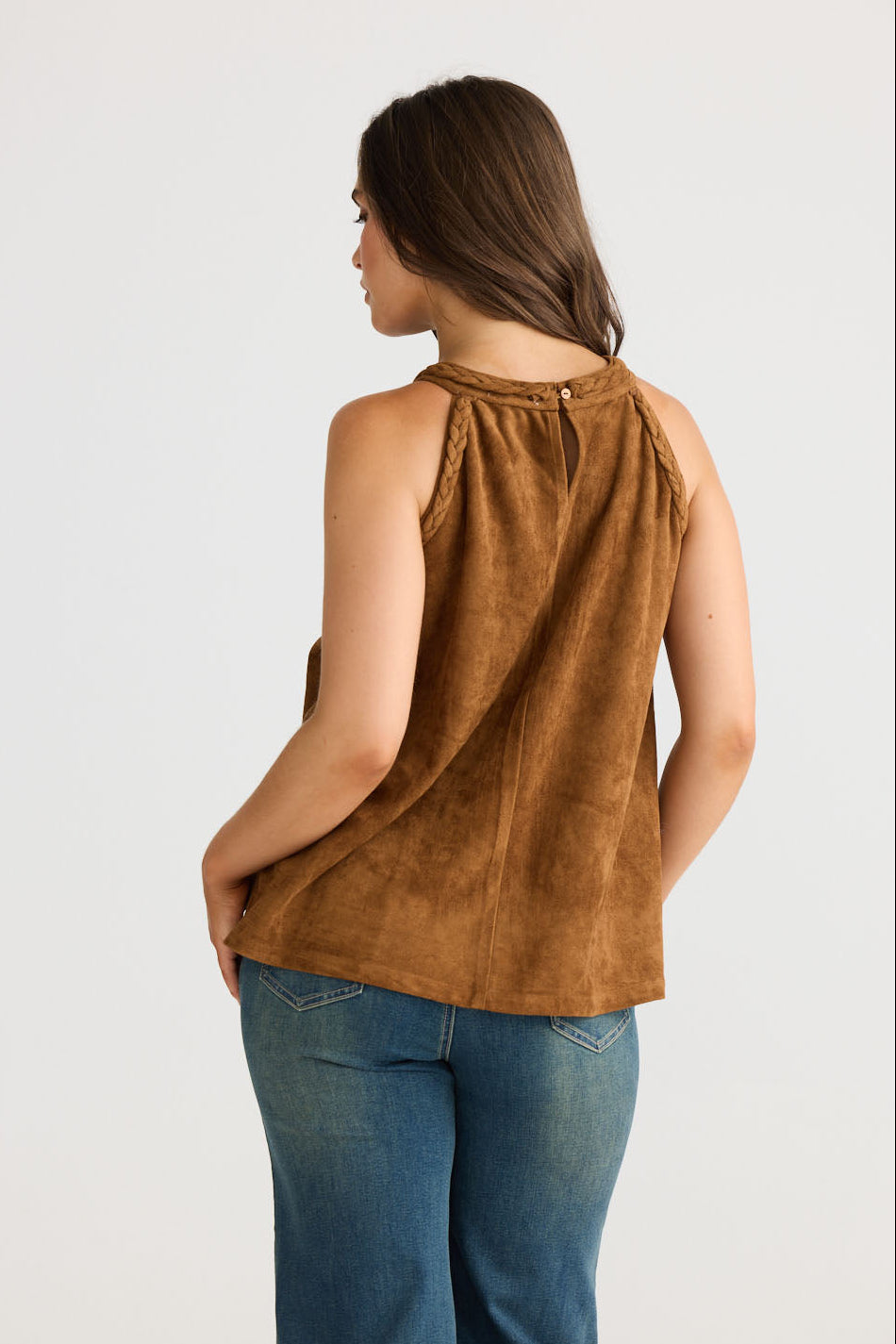 Model wearing Verae Top in chocolate with halter neckline and A-line silhouette, side view on white background