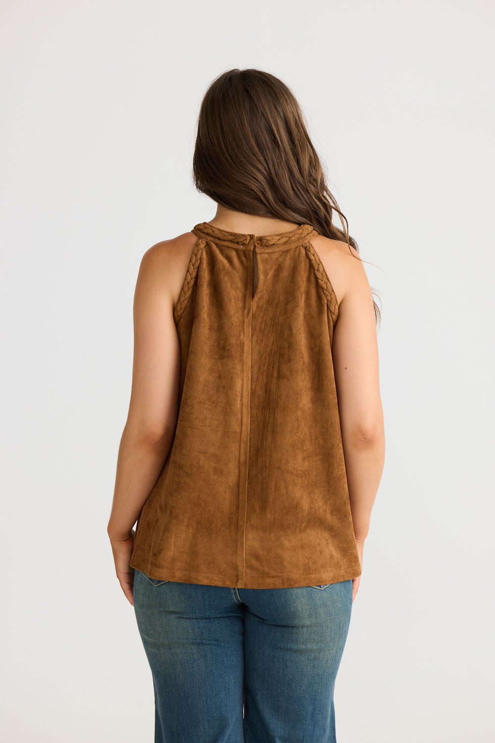 Model wearing Verae Top in chocolate with halter neckline and A-line silhouette, front view on white background