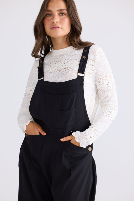 Close-up of Genie Overalls in black, detail view on white background