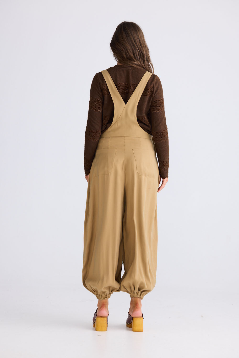 Close-up of Genie Overalls in camel, detail view on white background