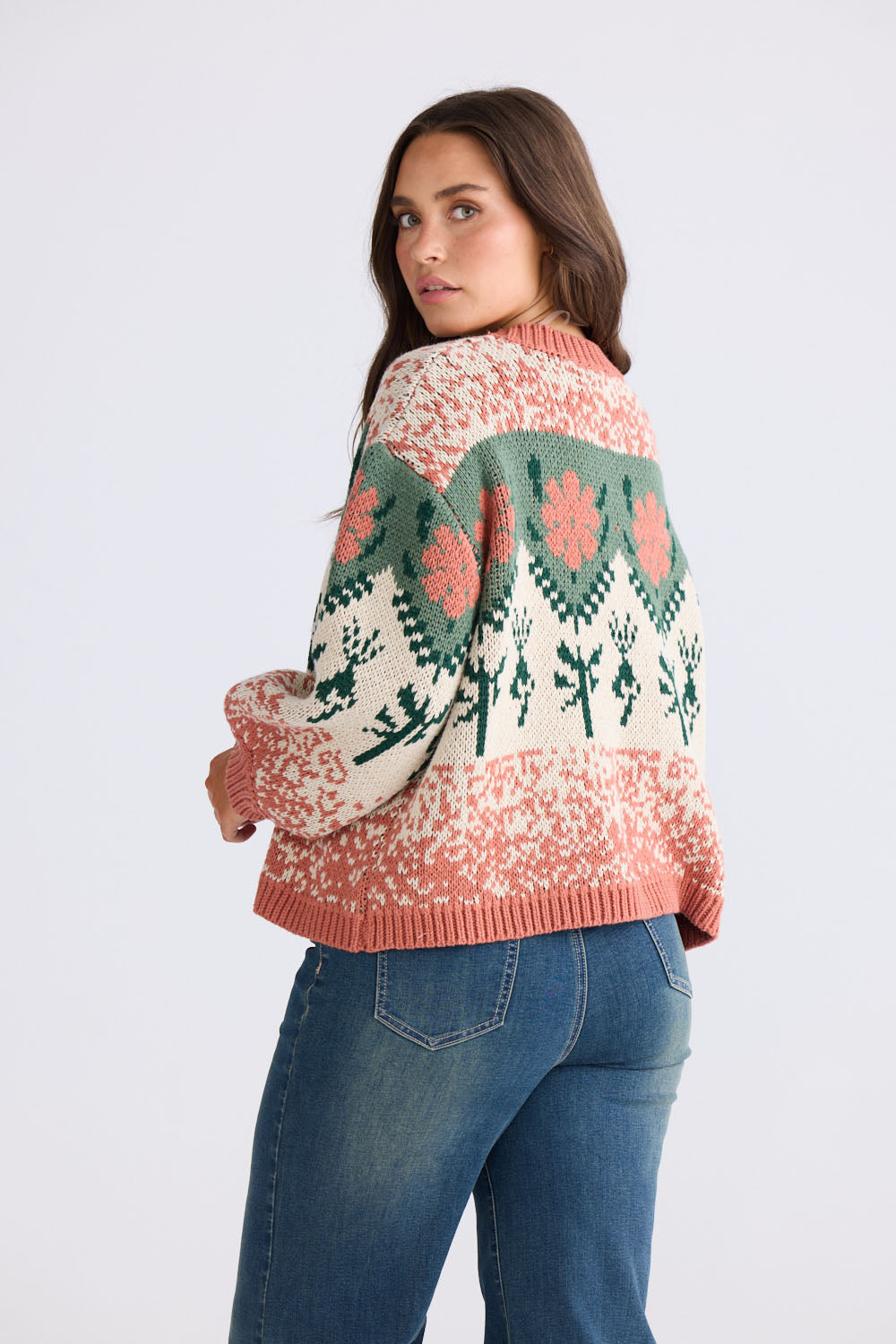 Model wearing Cottage Knit in terracotta and green with ribbed neckline and dropped shoulder, front view on white background