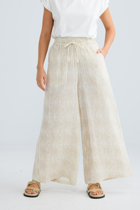 Freedom Pant in natural stripe, close-up of the drawstring tie waist and wide leg.