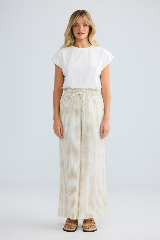 Freedom Pant in natural stripe, front view styled with a white tee.