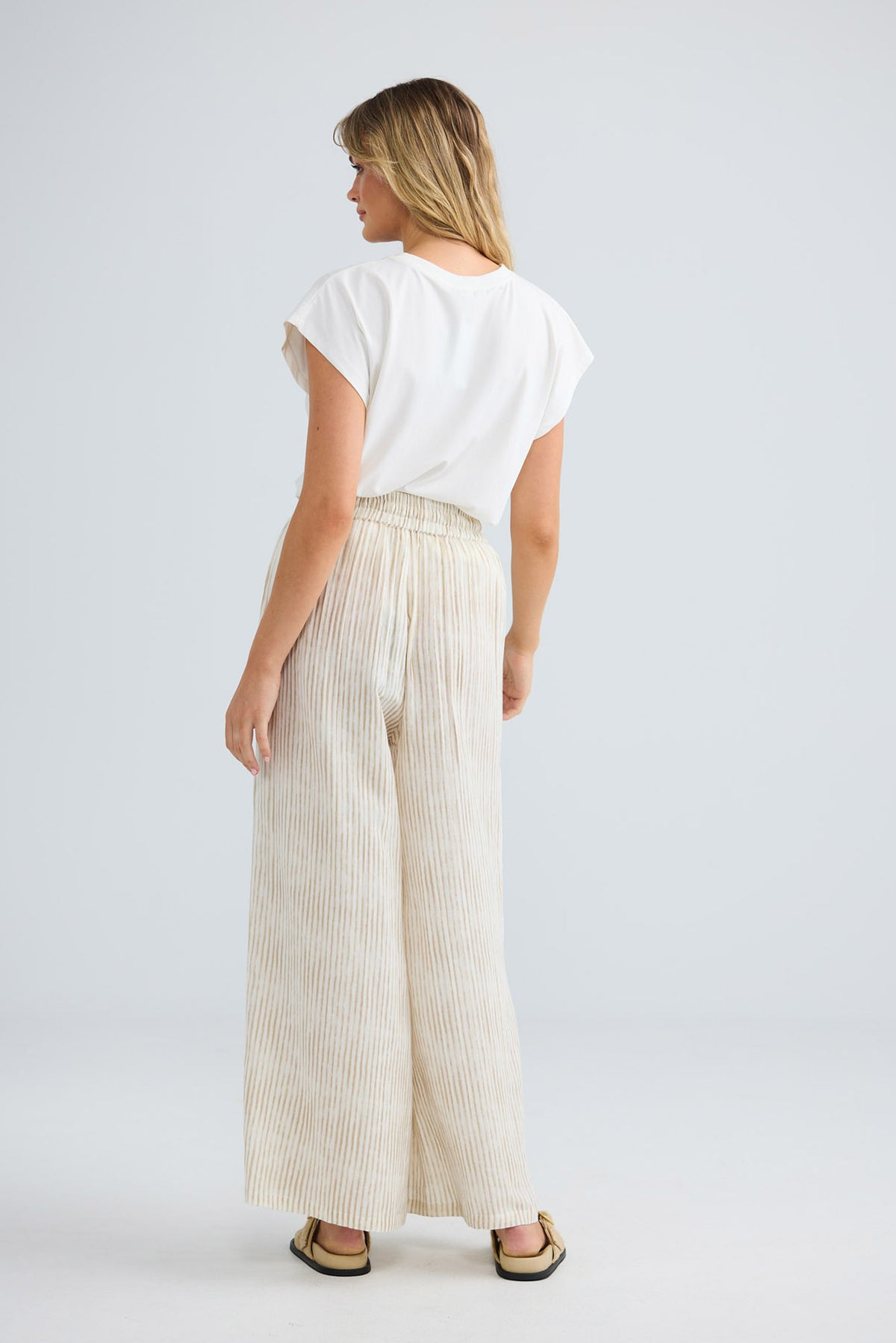 Freedom Pant in natural stripe, back view showing the wide leg.