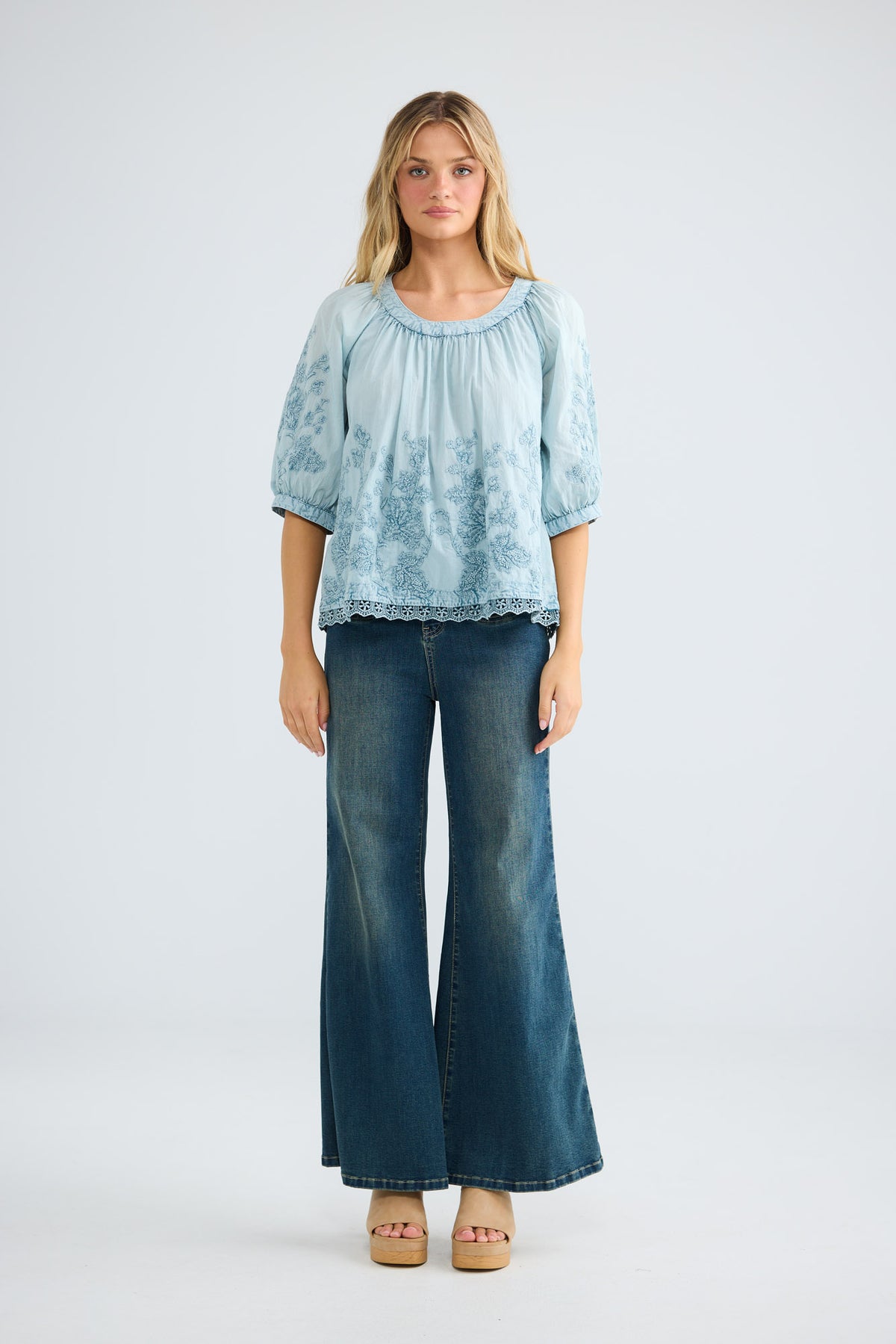 Thistle Top in powder blue with a gathered round neckline.