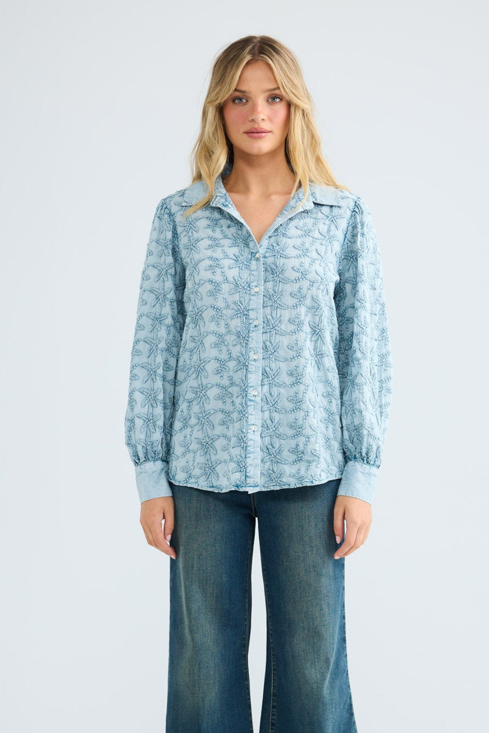 Flower Child Shirt in powder blue embroidery, front view styled with wide-leg denim.