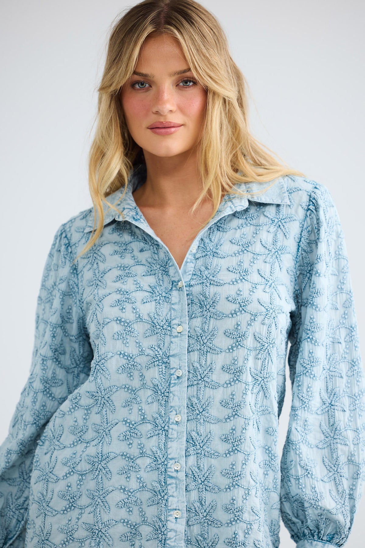 Flower Child Shirt in powder blue, close front view showing the all-over embroidery and collar.