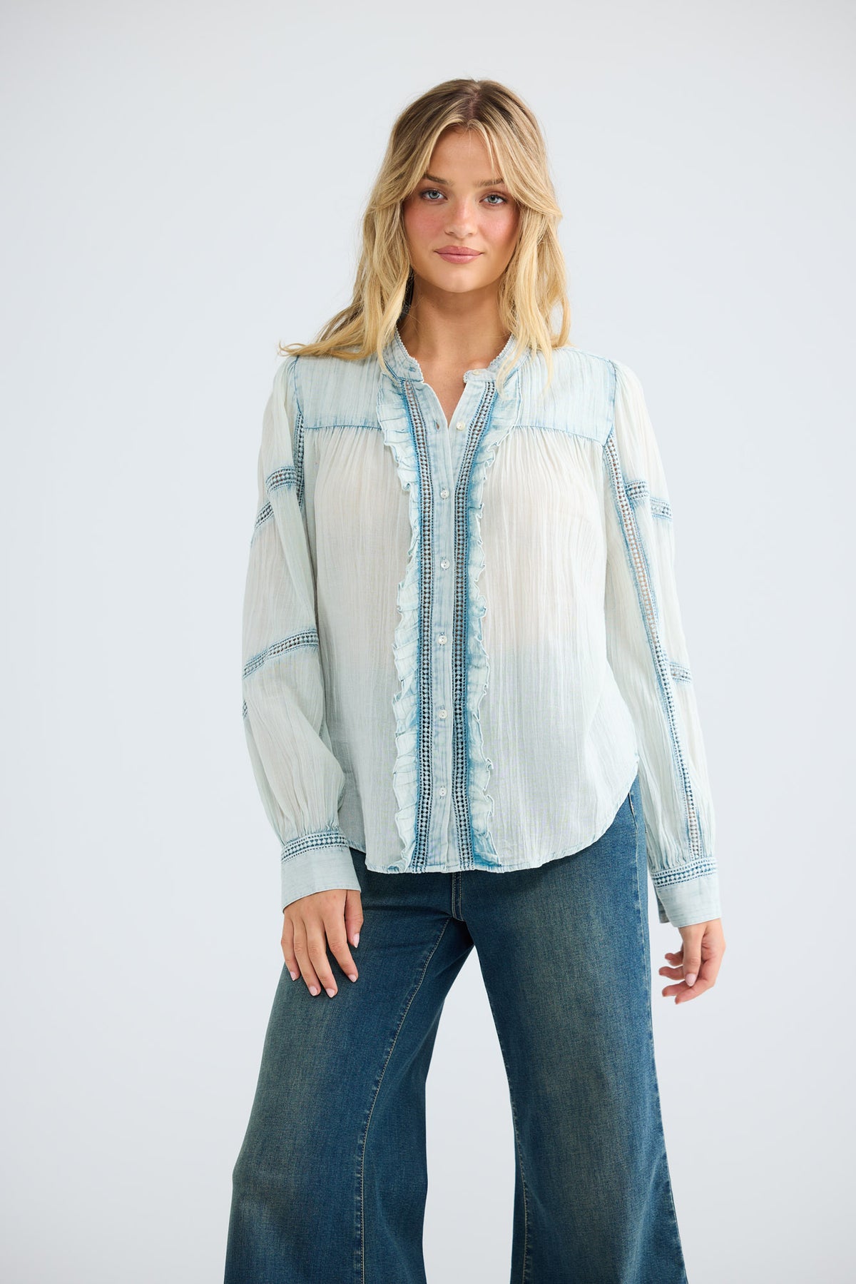 Amira Shirt in powder blue, front view showing the ruffle and lace detail.