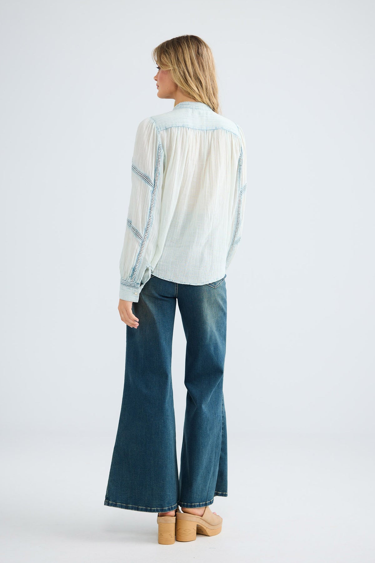 Amira Shirt in powder blue, three-quarter back view.