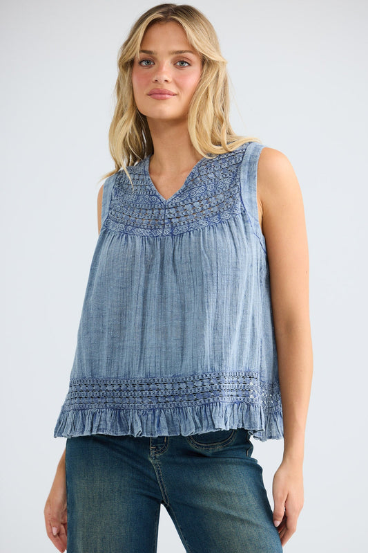 Freesia Top in steel blue, close front view showing the V neckline and embroidery.