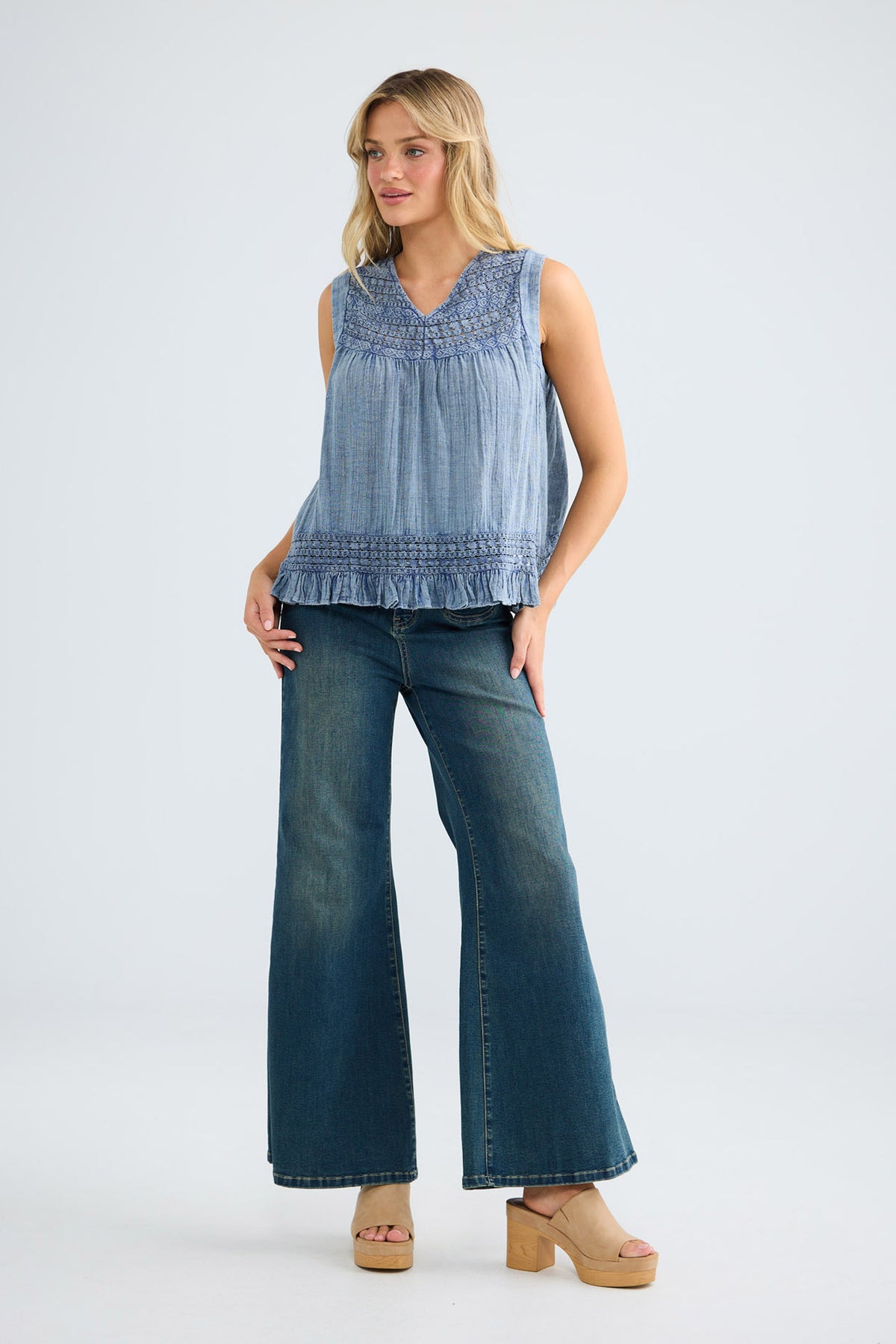 Freesia Top in steel blue, full-length front view styled with wide-leg denim.