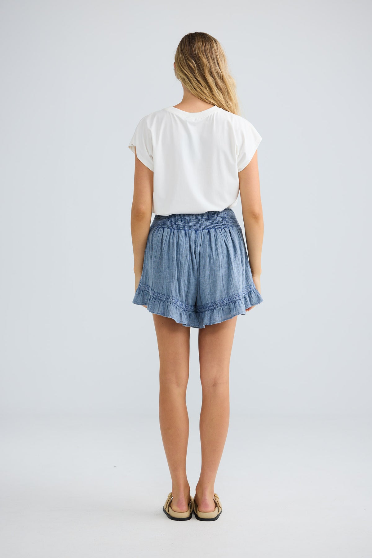 Ithika Short in steel blue, back view.