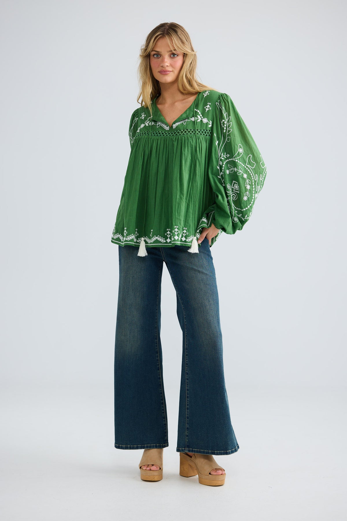 Sapphire Top in olive with white embroidery, full-length front view styled with wide-leg denim.