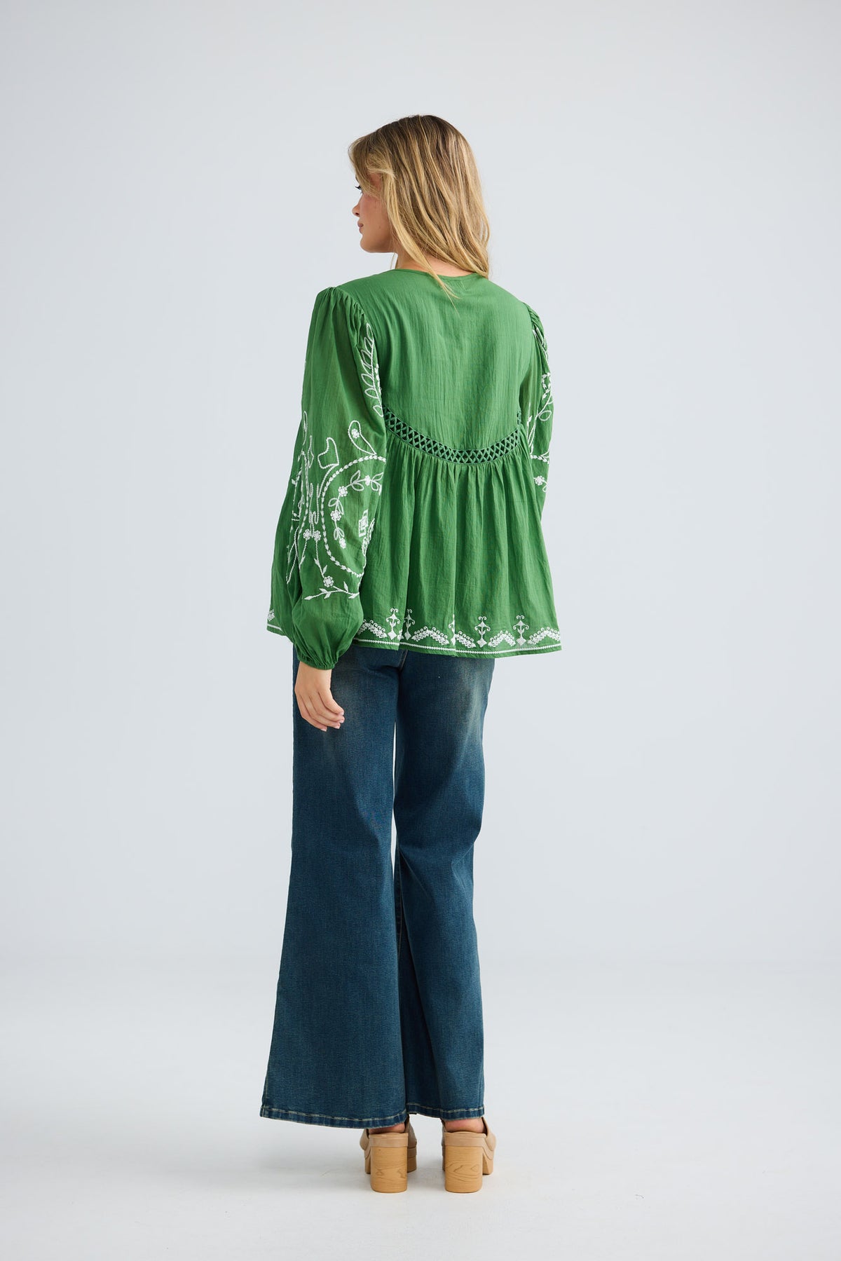 Sapphire Top in olive with white embroidery, back view.