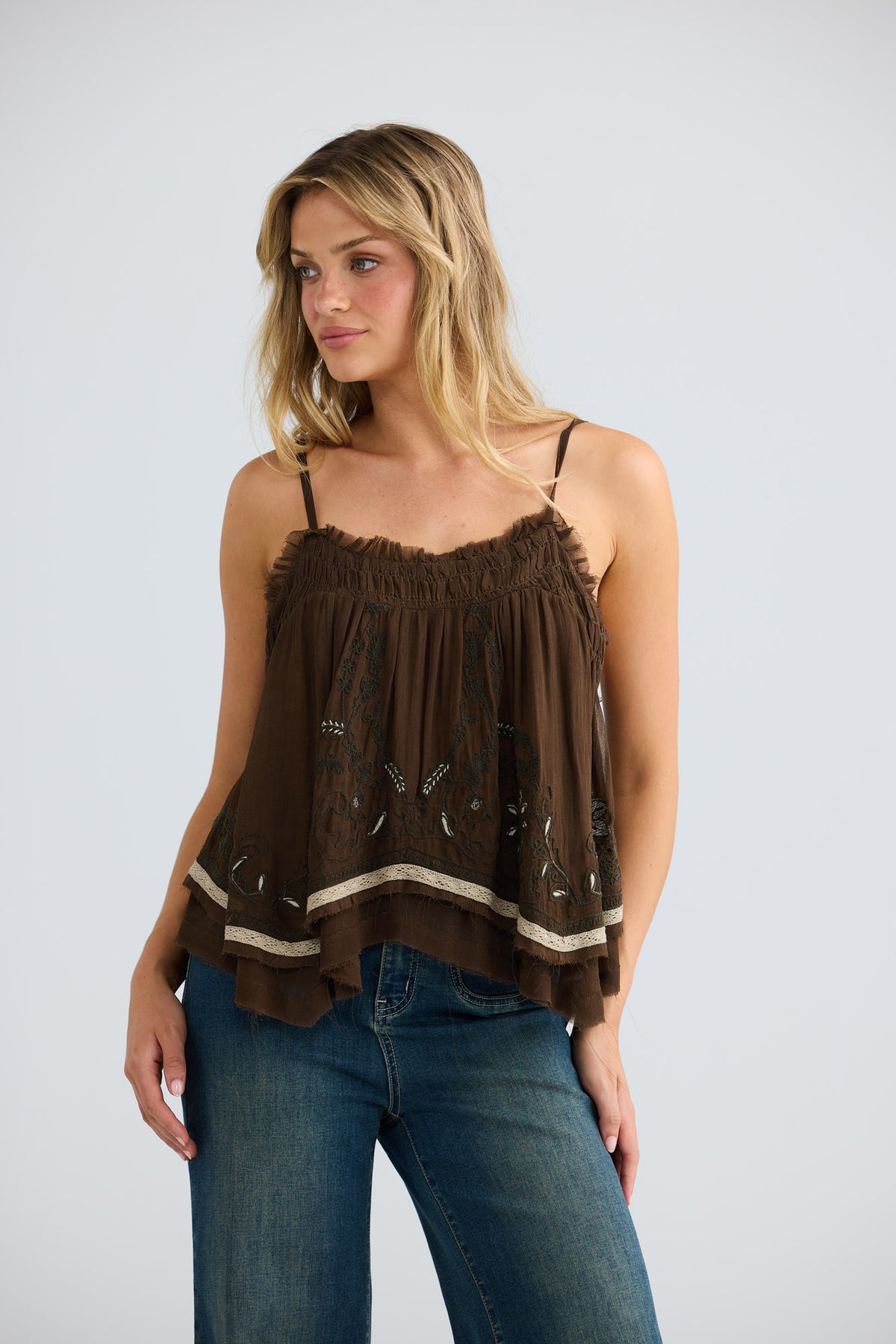 Ambrosia Top in cocoa embroidery, front view styled with denim.