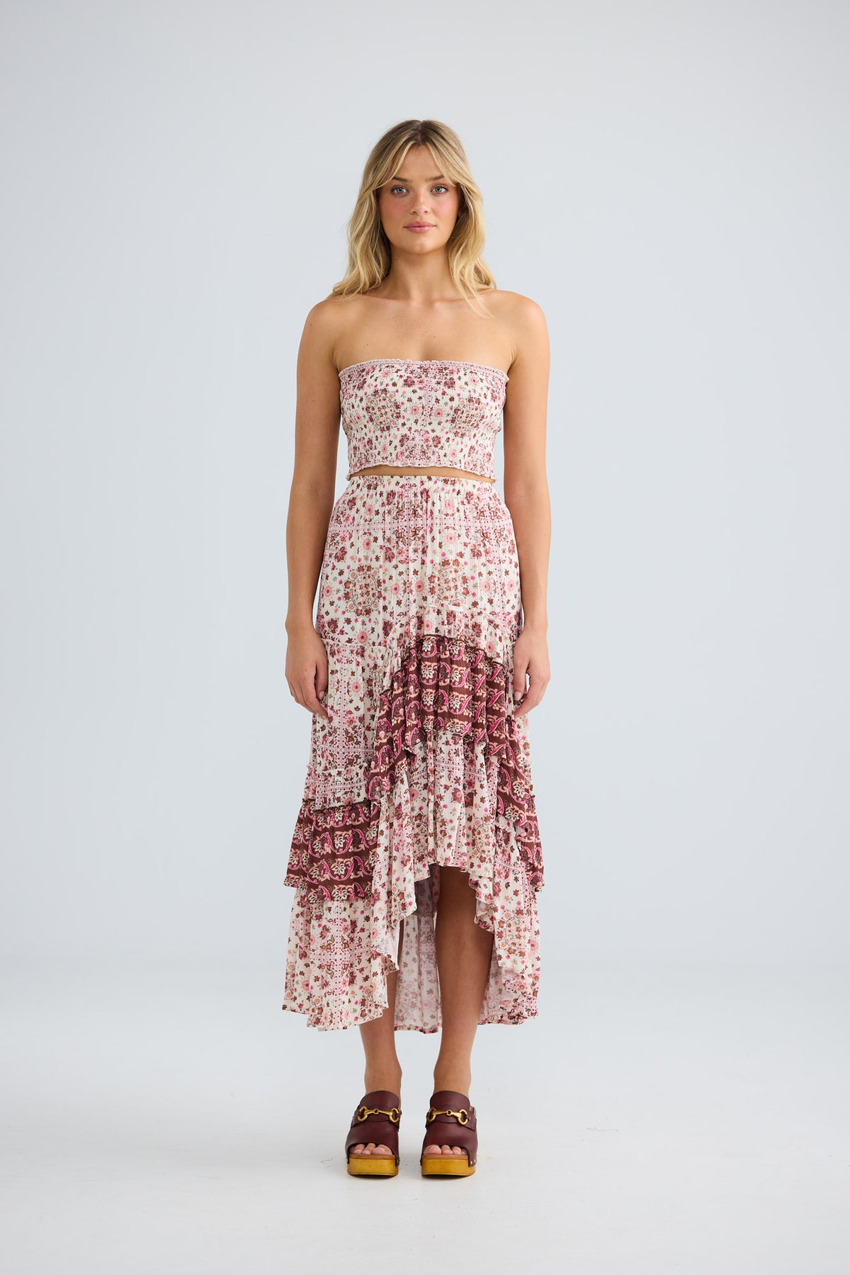 Model wearing Sassy Skirt in chai floral, front view.