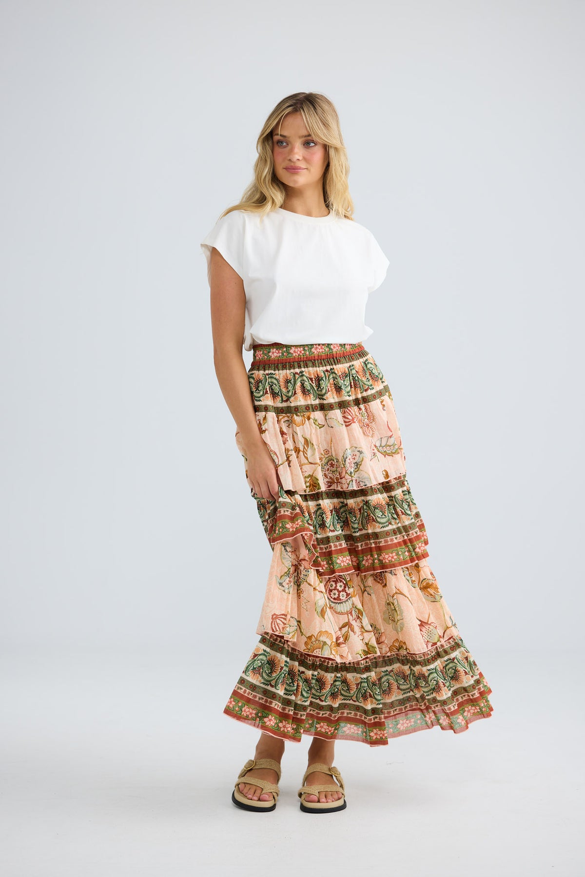Model wearing Ariel Maxi Skirt in wildflower oasis, front view.