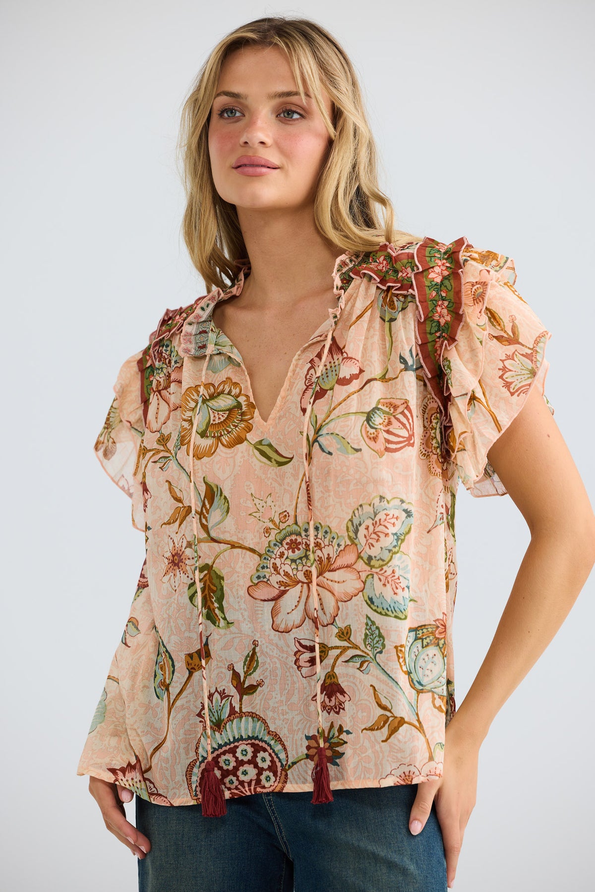Sorrae Top in wildflower oasis with layered ruffle details.