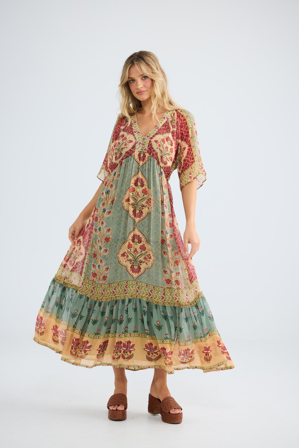 Tulara Dress in garden mist, front view in motion.