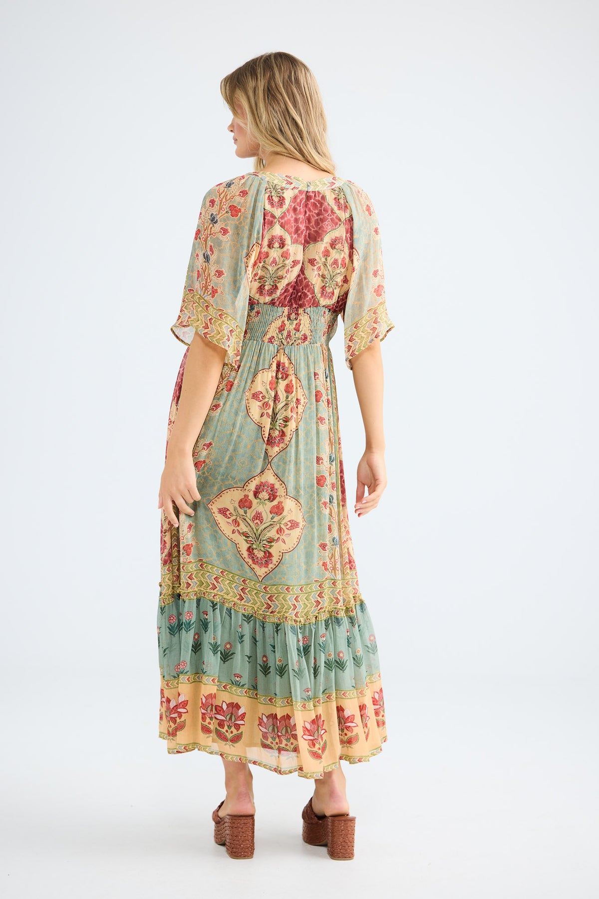 Tulara Dress in garden mist, view showing the frill hem panel.