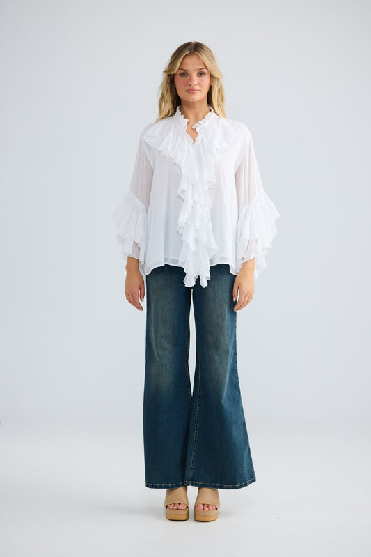 Maika Frill Shirt in white with cascading ruffle details.
