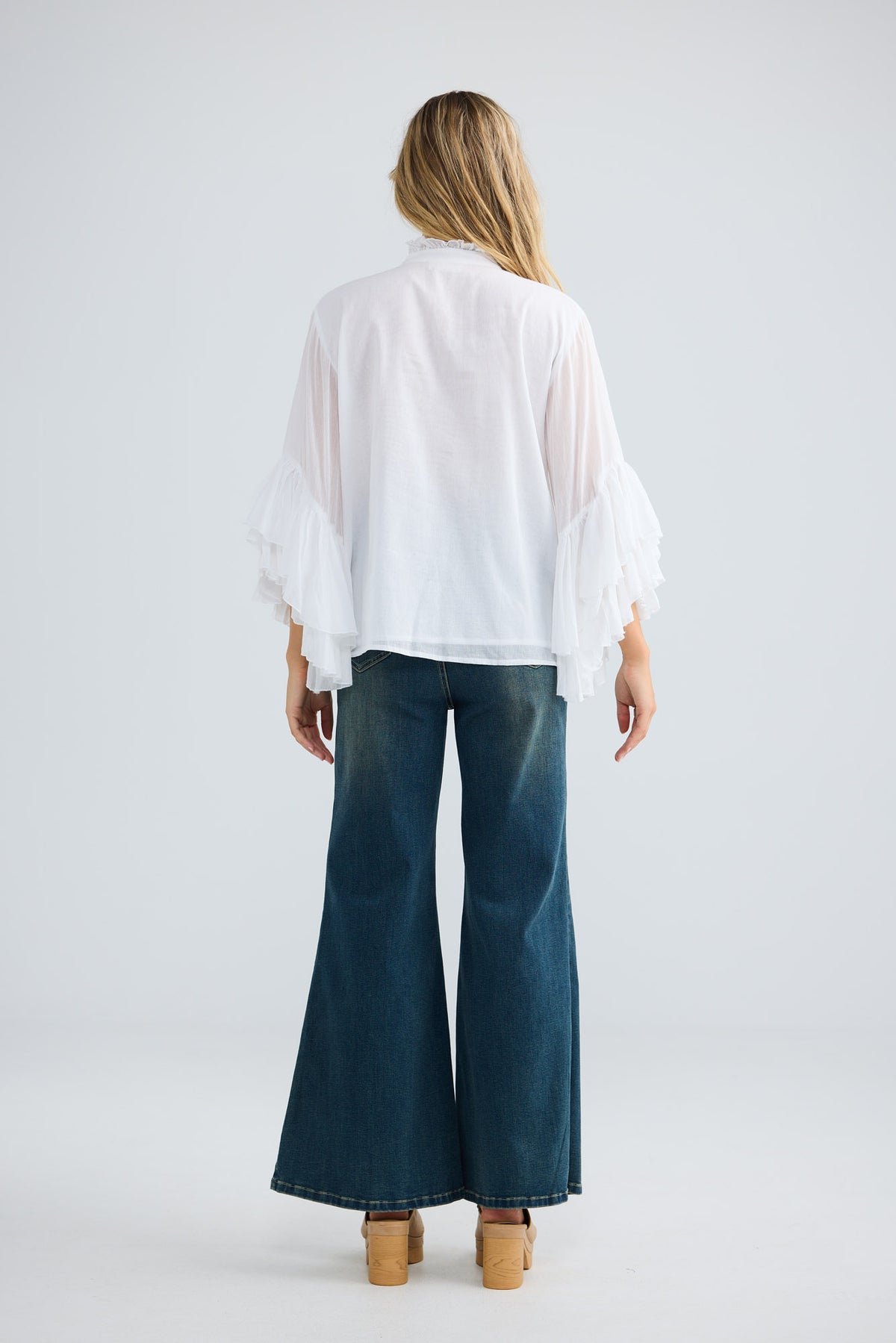 Maika Frill Shirt in white with a band collar.