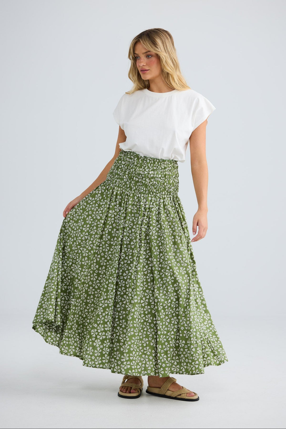 Model wearing Balmoral Skirt in sage petal, front view.