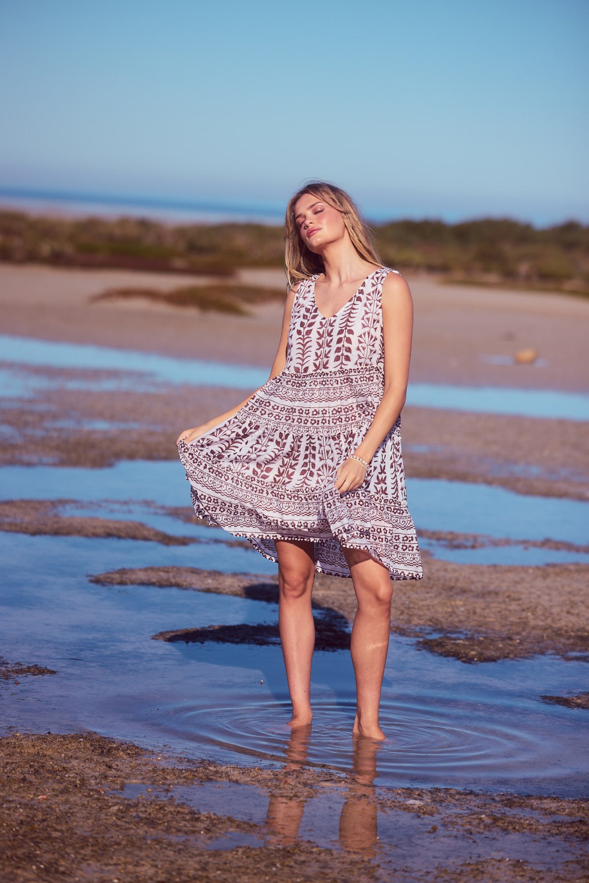 Lucky Charm Dress in chocolate paro with a gathered tiered design.