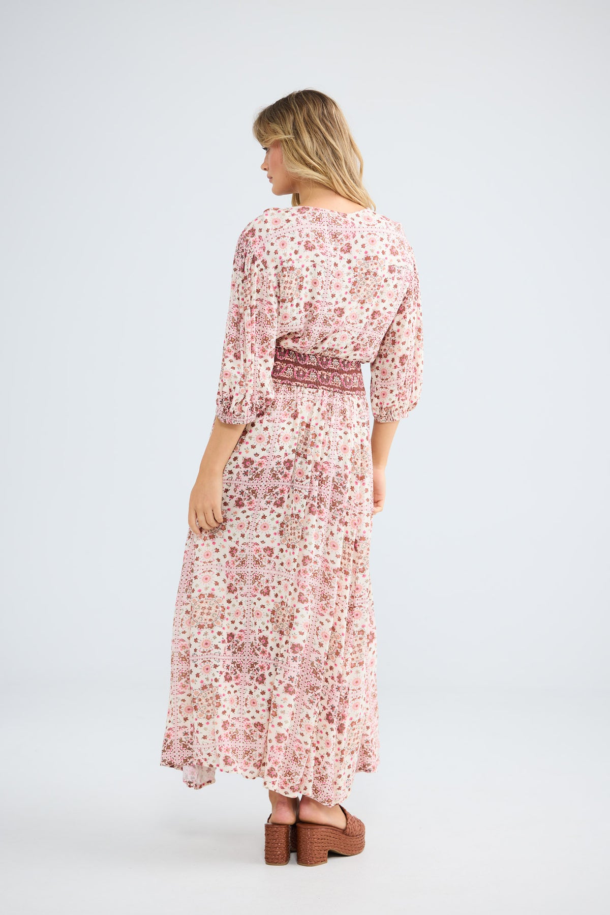 Model wearing Halo Dress in chai floral, front view.