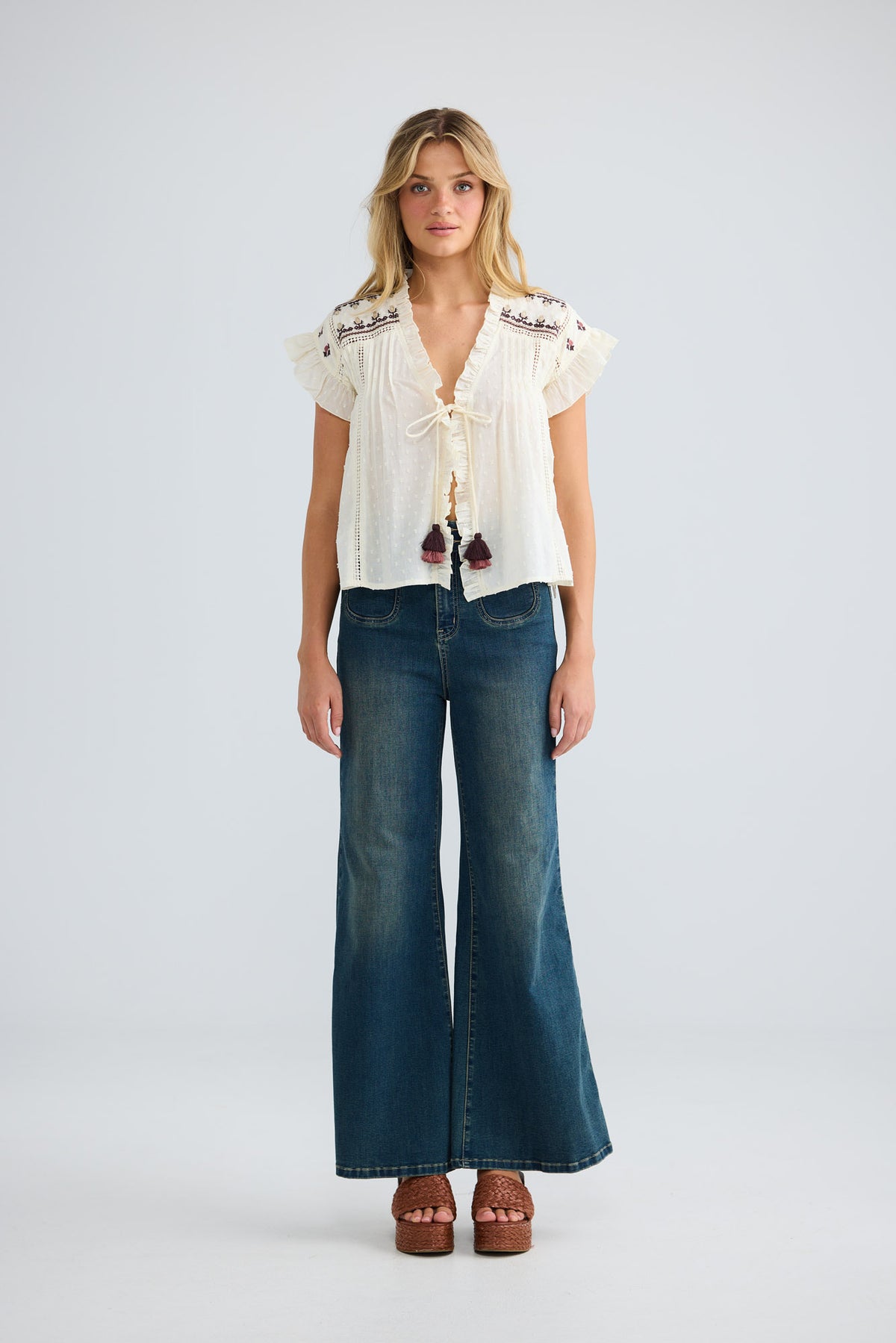 Saskia Tie Top in natural dobby with centre-front ties with tassels.