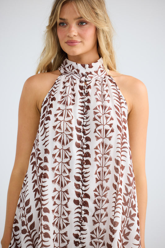 Model wearing Tapas Dress in chocolate paro, front view.
