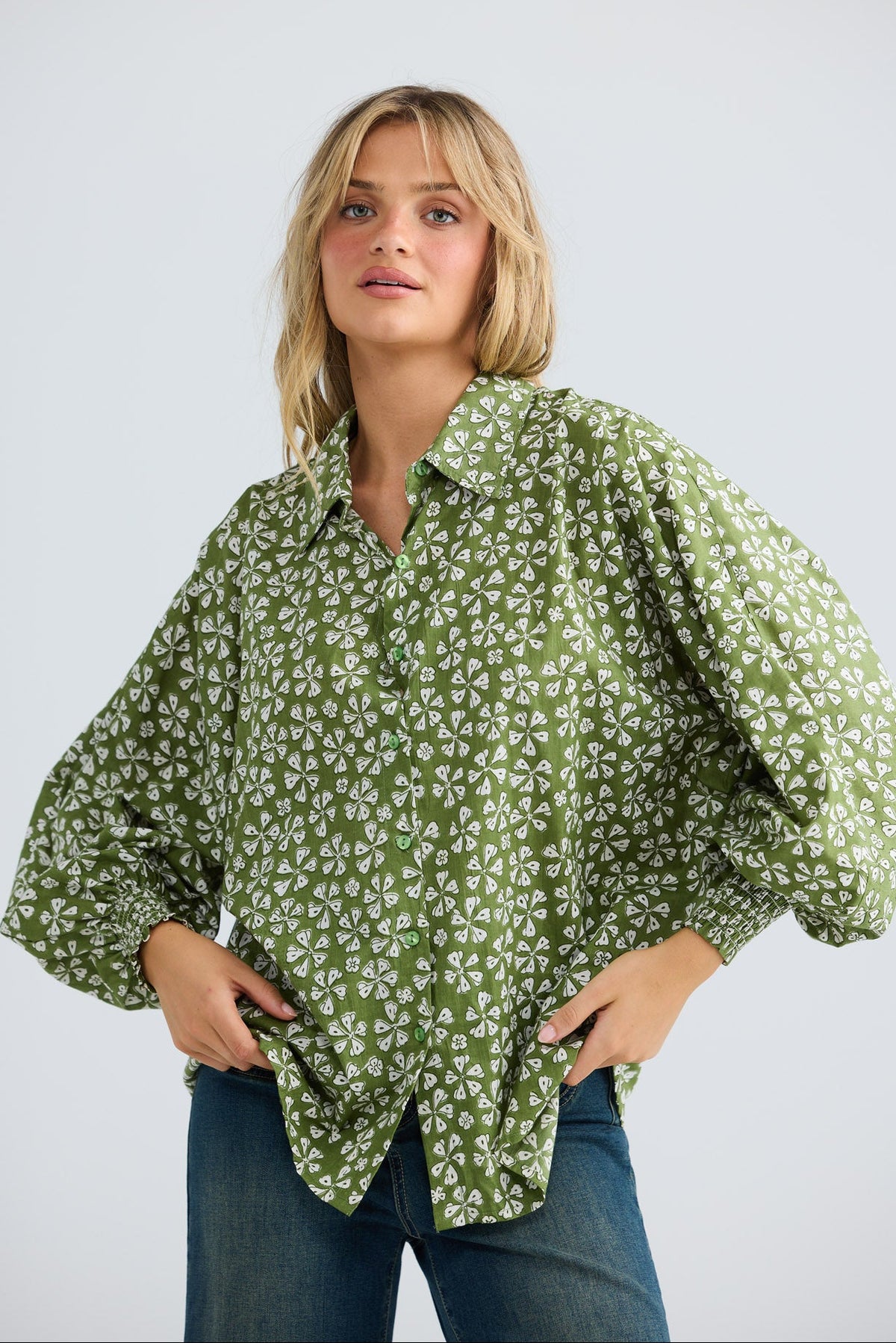 Model wearing Chantilly Shirt in sage petal, front view.