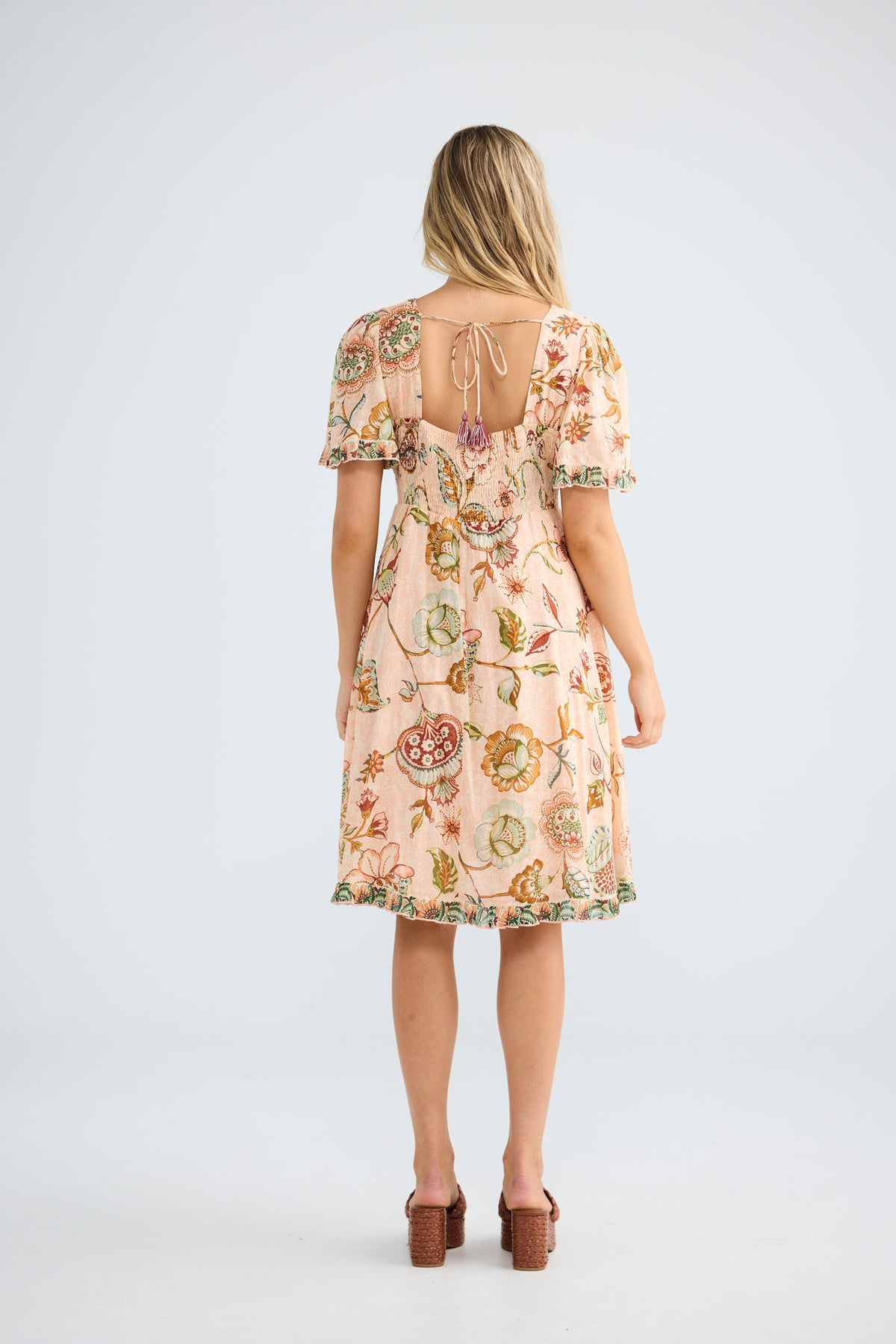 Tea Party Dress in wildflower oasis with ruffle detail on the hemline.
