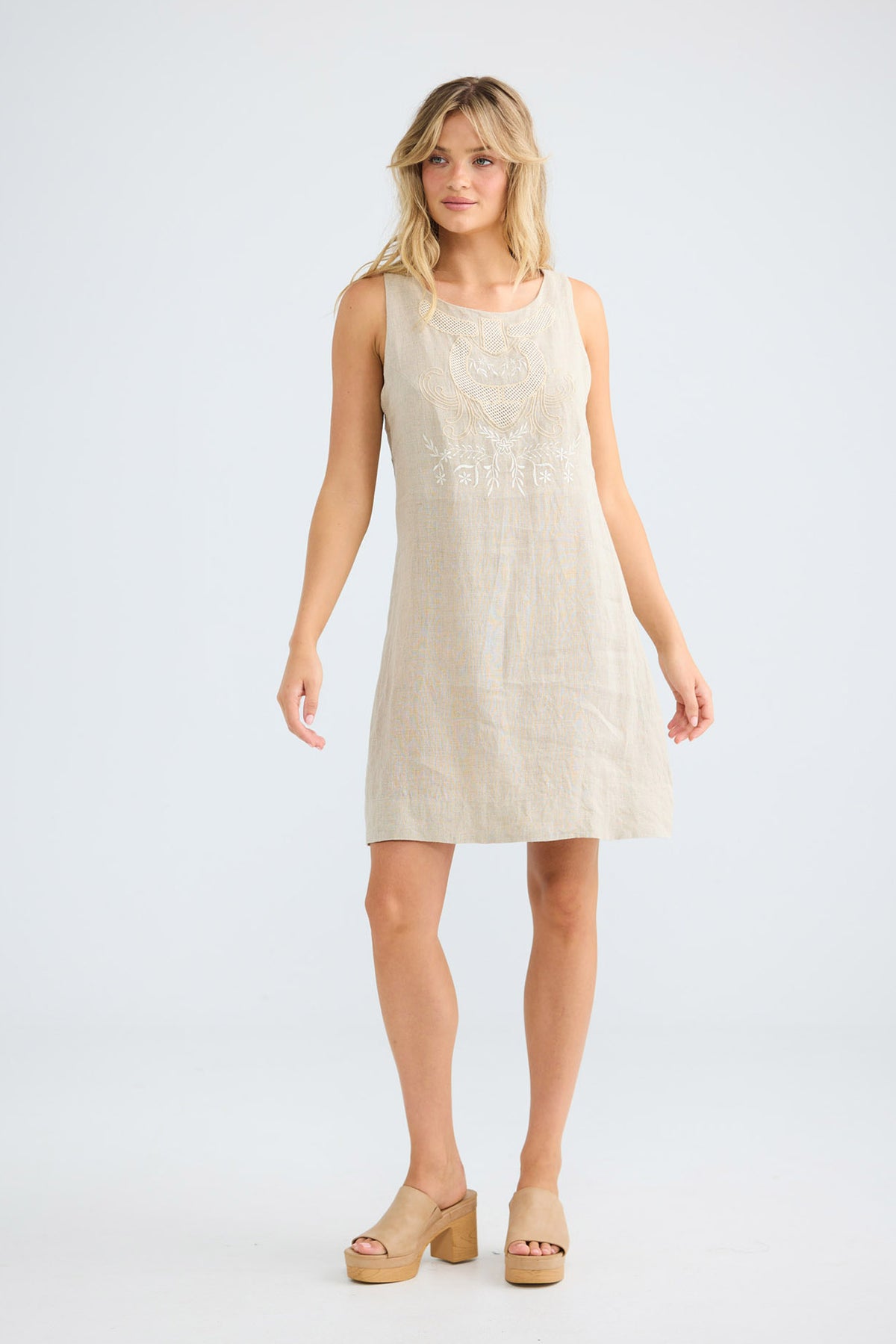 Model wearing Zephyr Dress in oat, front view.